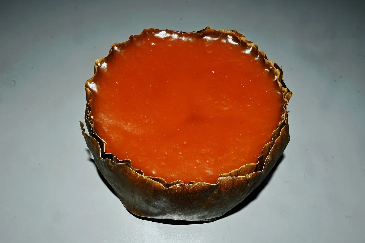A round nian gao wrapped in a dried leaf.