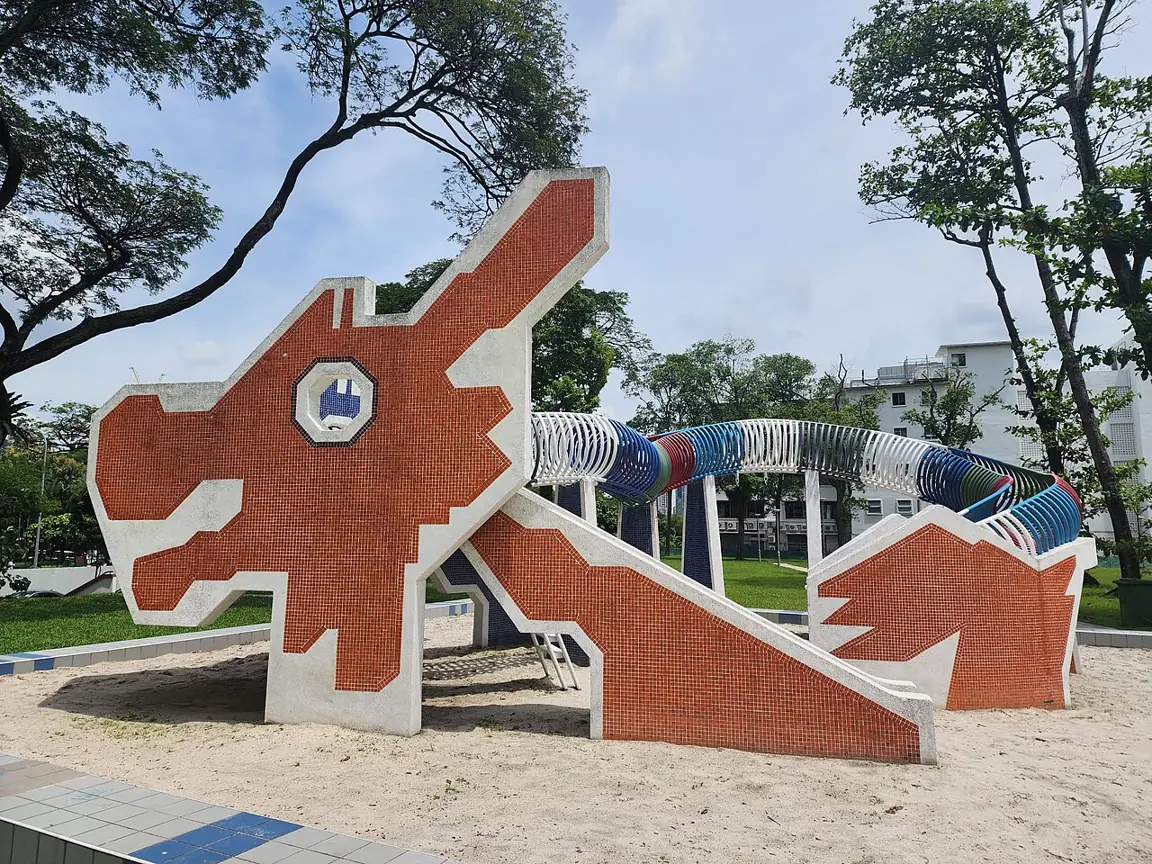 A distinctive playground stands on a sand surface in Singapore.