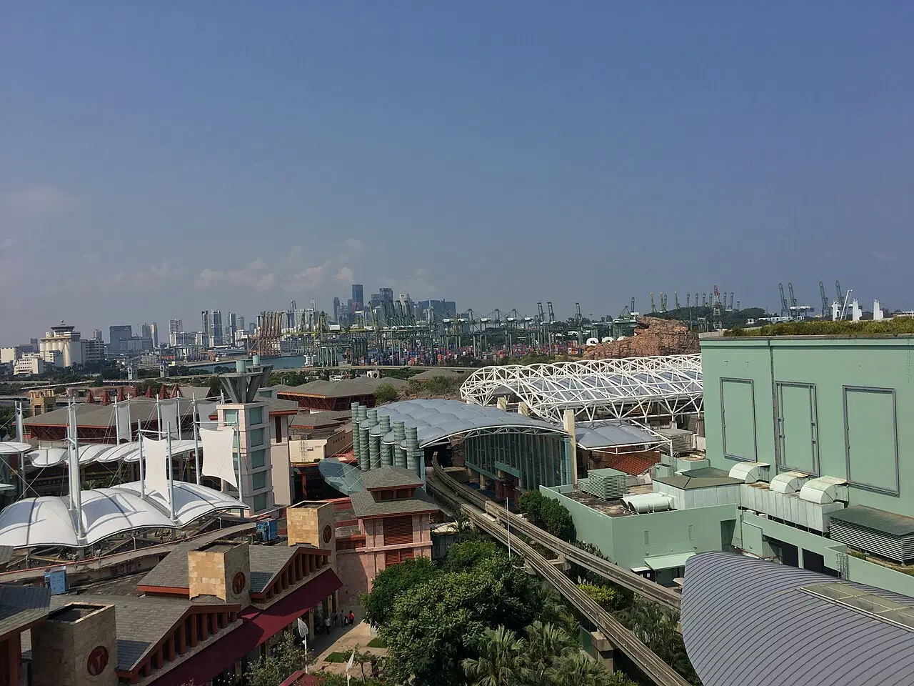 Cranes, containers and the city skyline spread across the Port of Singapore.