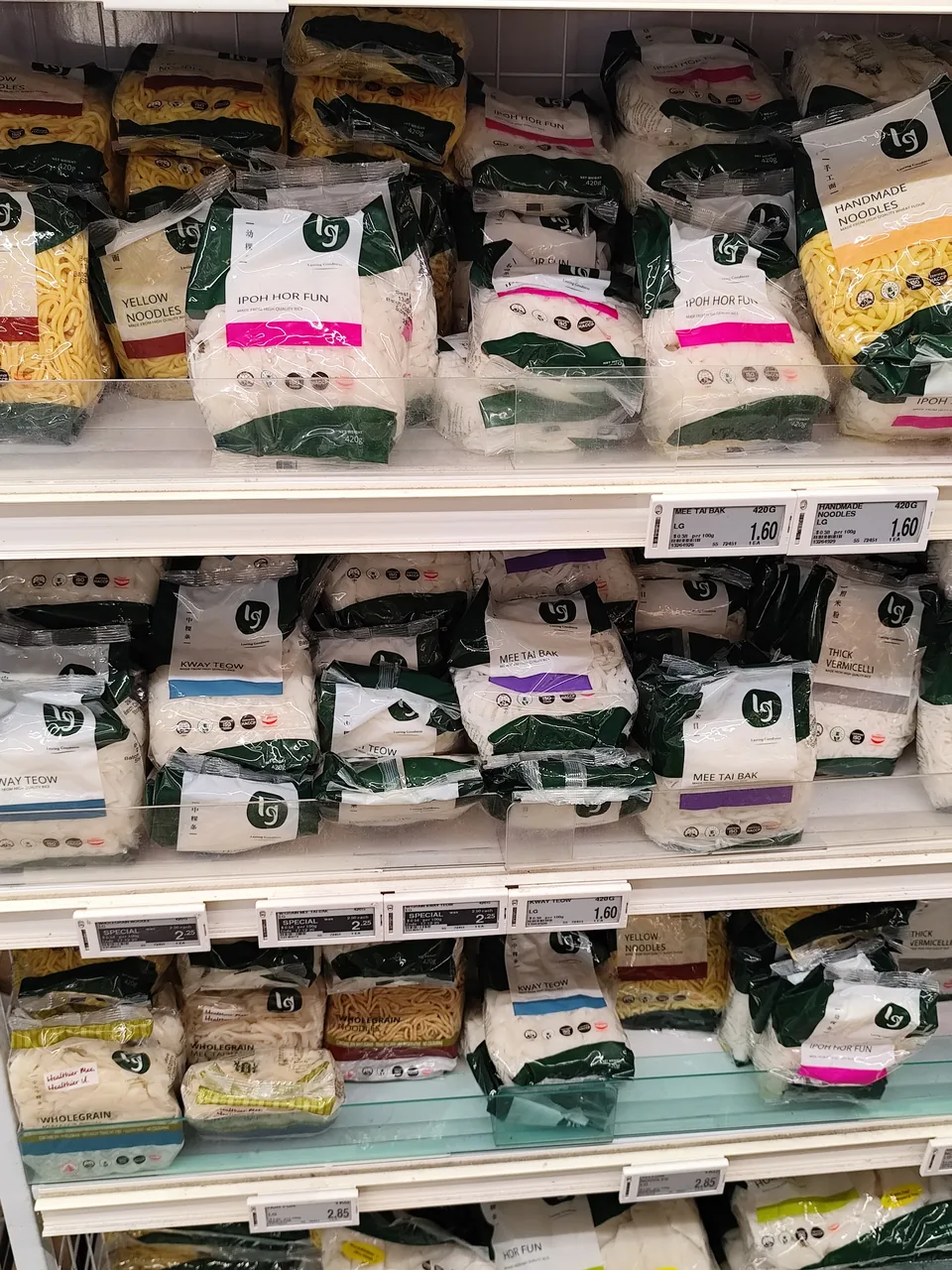 Packaged food fills neatly stacked supermarket shelves.