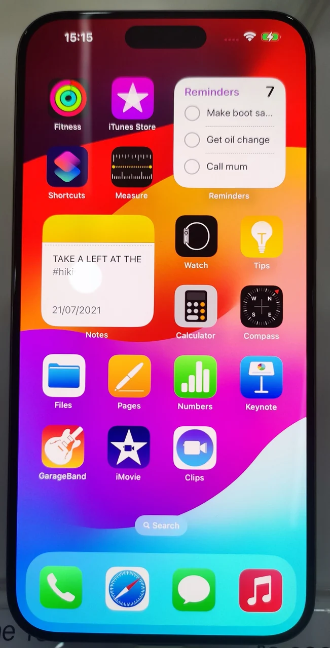 A smartphone screen shows colourful app icons.