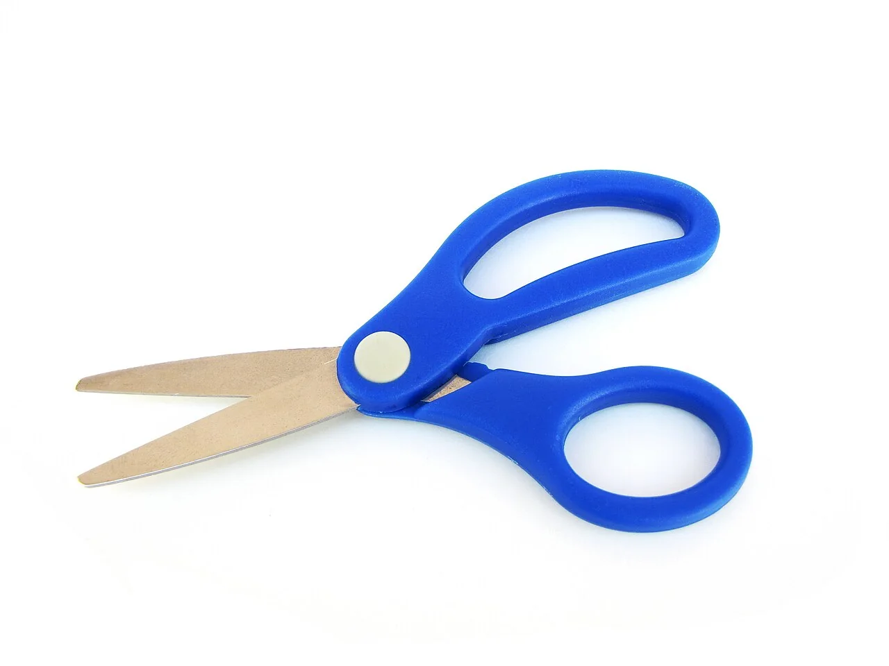 A pair of scissors with blue plastic handles and metal blades lies open on a white surface.