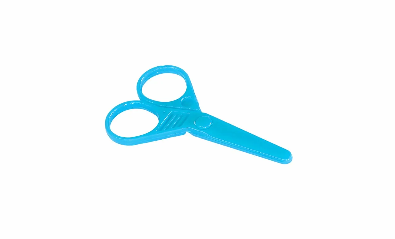 Blue child-safe scissors lie on a white background.