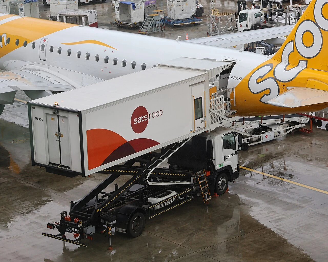 Raised SATS Food aircraft catering truck at Changi Airport.