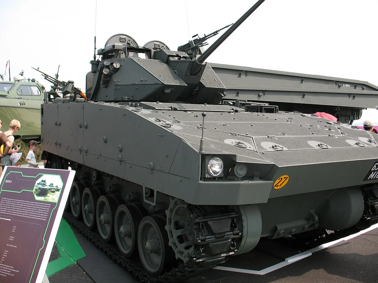 A Bionix armoured vehicle has metal tracks and a sloping front.