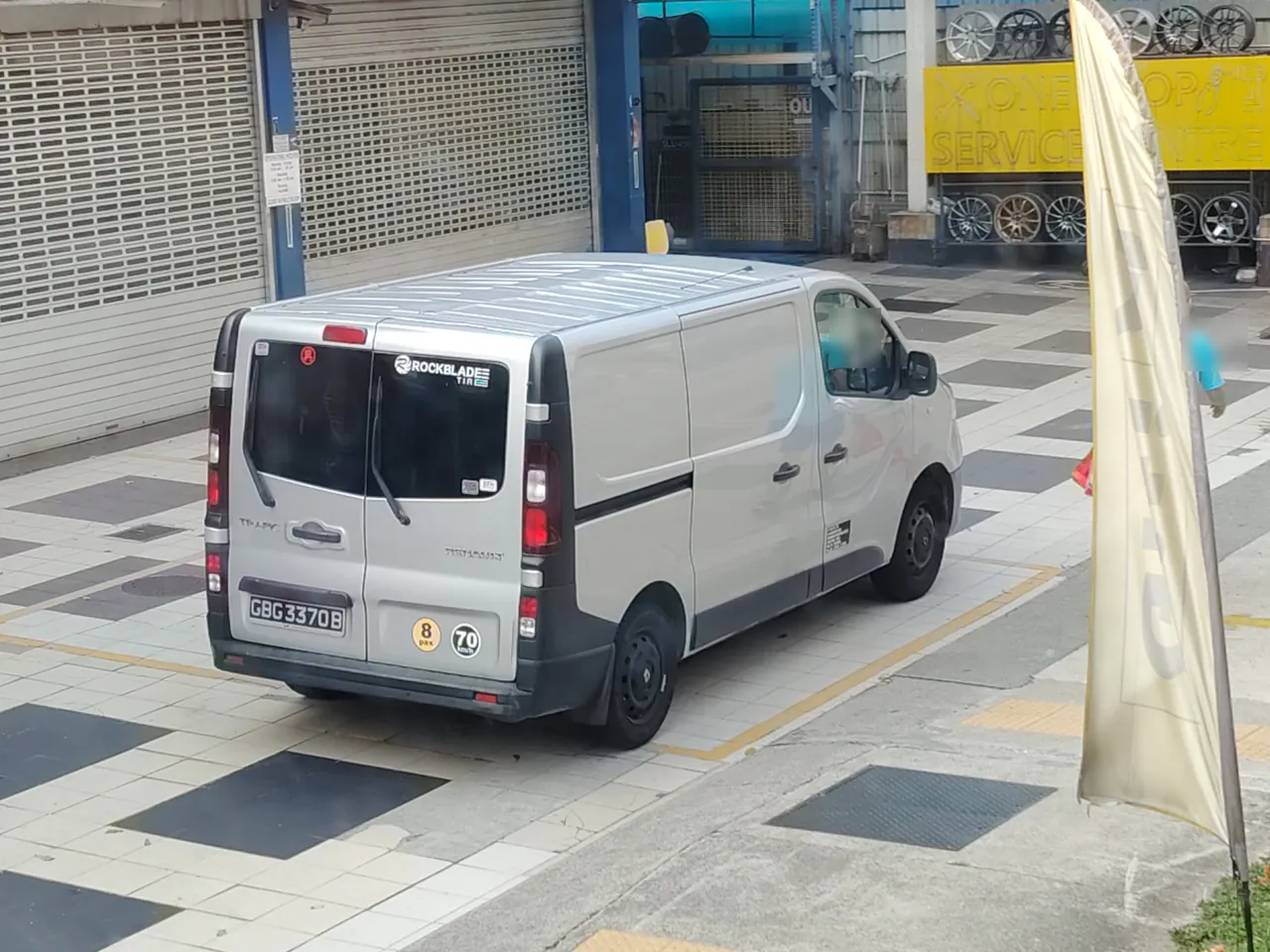 Delivery van — a white delivery van with no windows in the back.