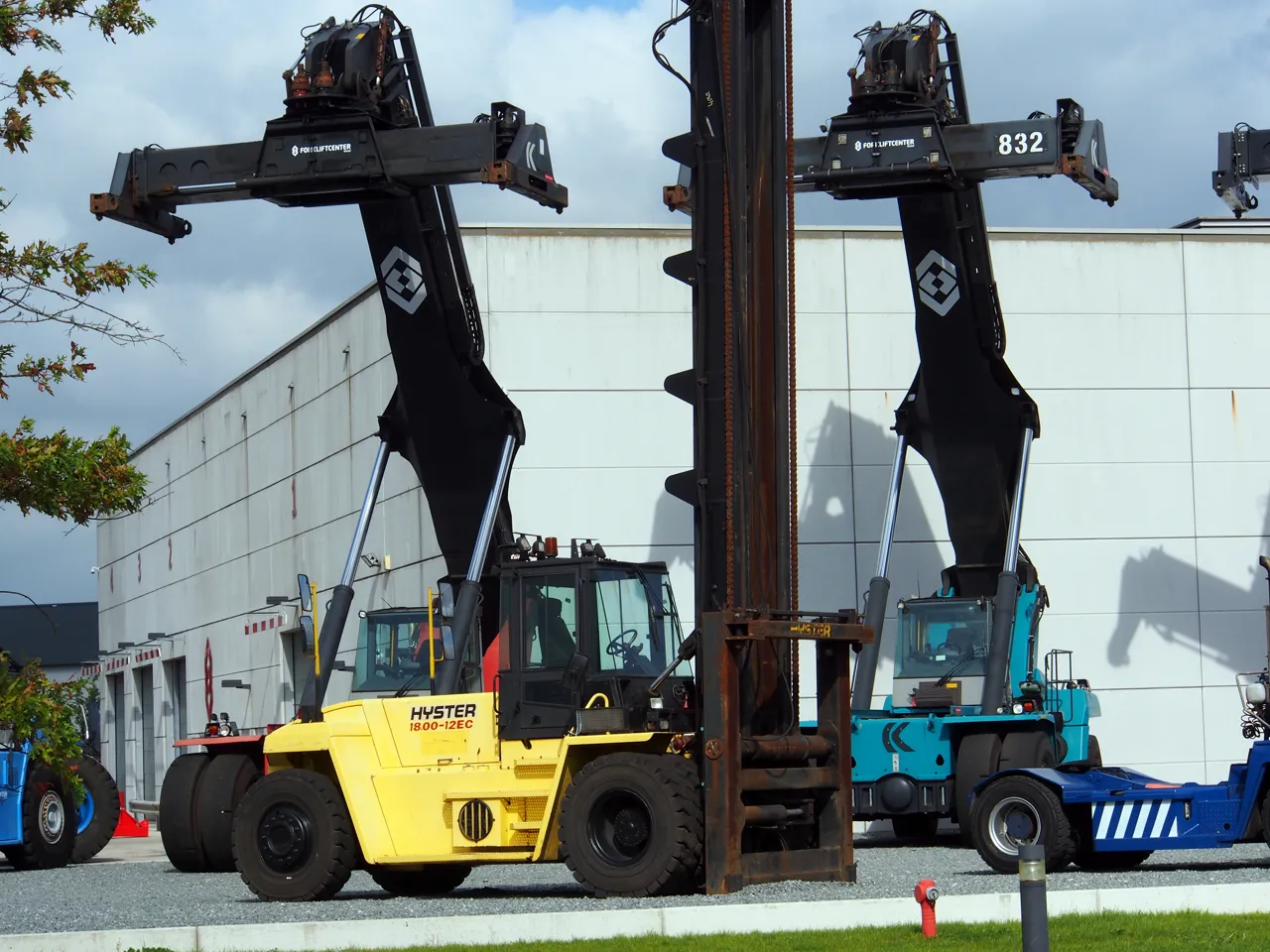 Empty-container handler with its mast raised.