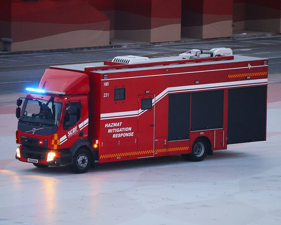 A red emergency truck has a box-shaped rear body.