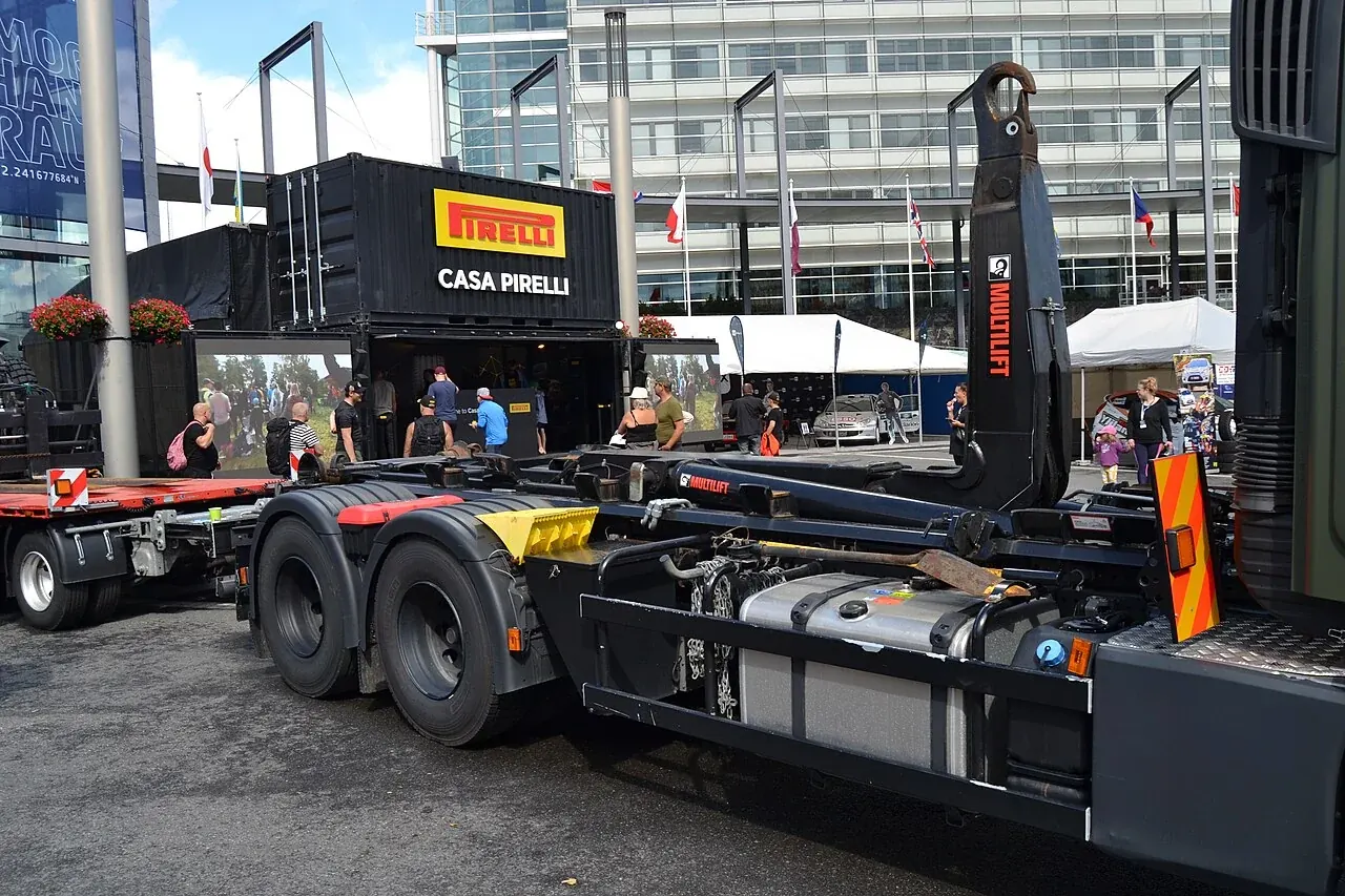 The raised hook arm and empty chassis of a hooklift truck in Finland.