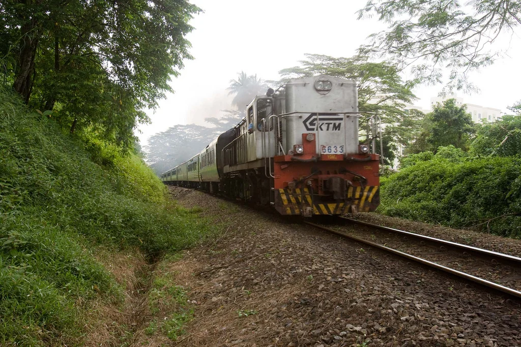 A KTM train is pictured on a tree-lined track in Singapore in 2010.