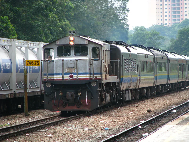 This 2009 photo shows a KTM locomotive and passenger coaches at Kempas Bahru station.