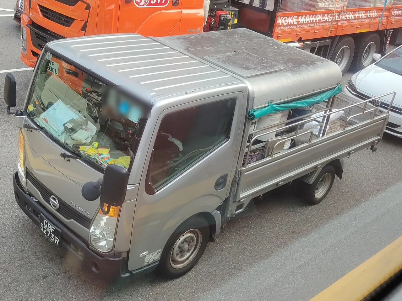 Lorry — a small silver lorry with drop-down sides and a roof over the cab.