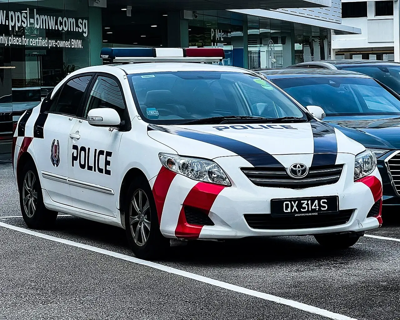 A marked Singapore Police Force Toyota patrol car.