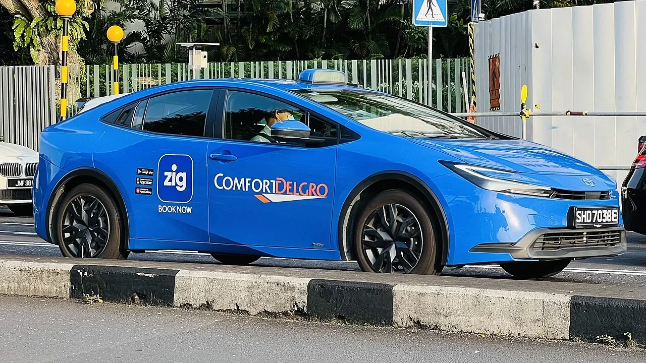 Blue ComfortDelGro electric taxi in Singapore.